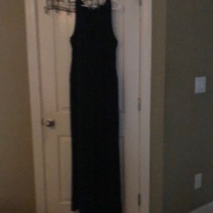 Black sleeveless rayon and polyester jump suit.